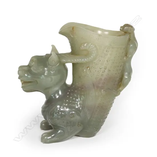 A finely carved jade figured libation cup,