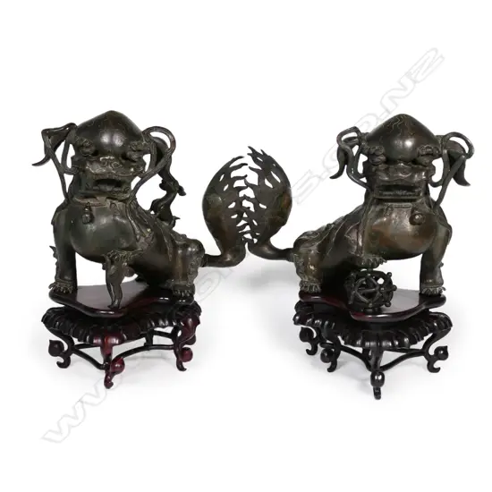A pair of 19thC Chinese bronze fu dogs,