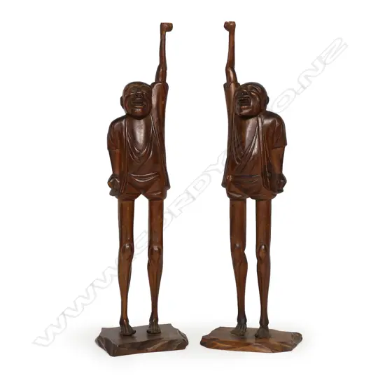 A pair of old carved wood oriental standing comical figures,