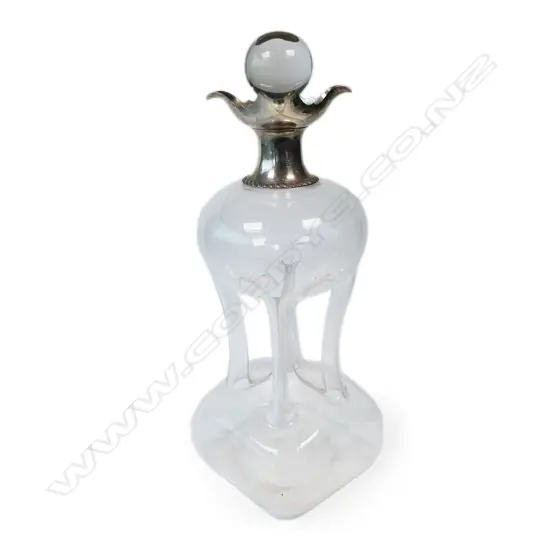 A large silver collared 'glug glug' decanter,