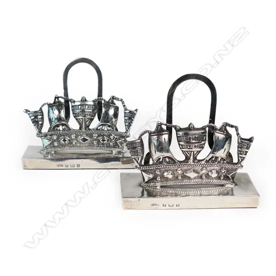 A pair of silver Royal Naval menu holders,