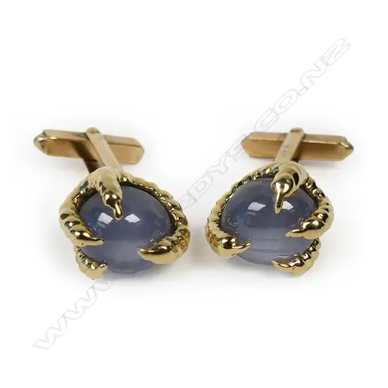 A pair of designer 9ct yellow gold and star sapphire cufflinks,
