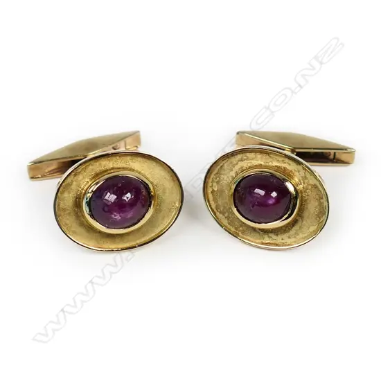 A pair of handmade 18ct and 9ct yellow gold and star ruby cufflinks,