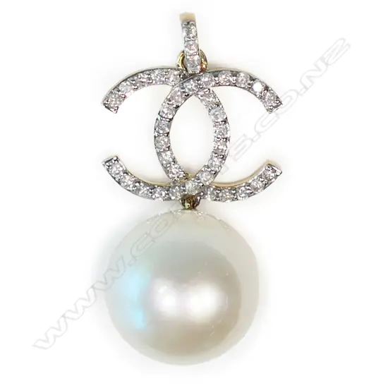 A 14ct gold, pearl and diamond Chanel inspired pendant,