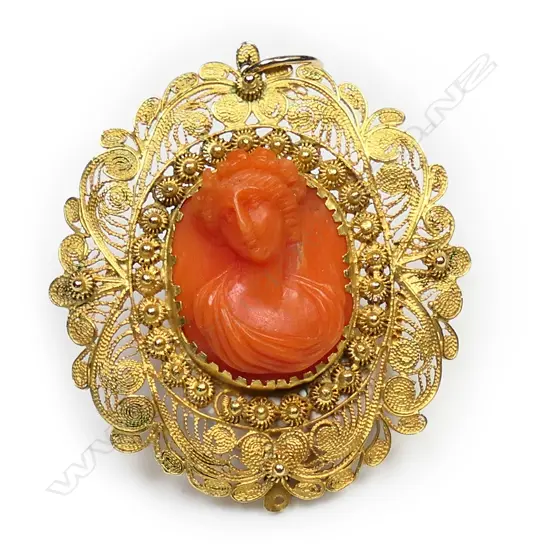 A 19thC Italian 18ct. gold and coral pendant,