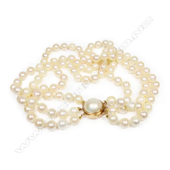 A three-strand pearl choker,