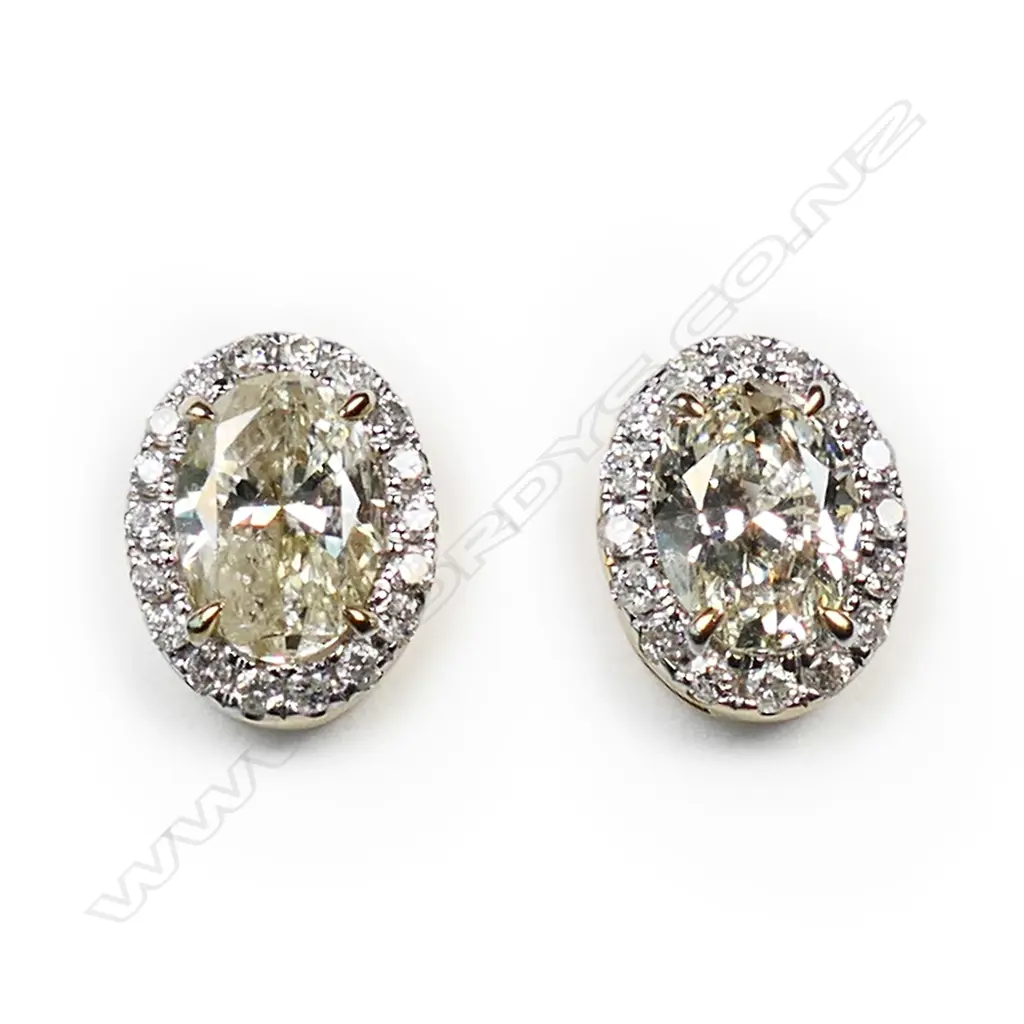 A pair of 14ct gold diamond halo stud earrings, Image 1++
