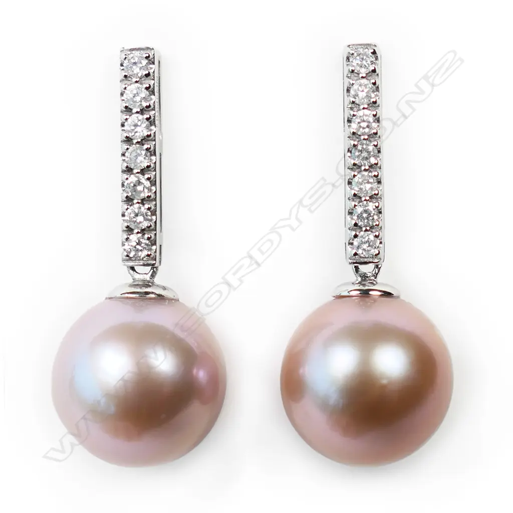 A pair of 14ct white gold pearl and diamond drop earrings, Image 1++