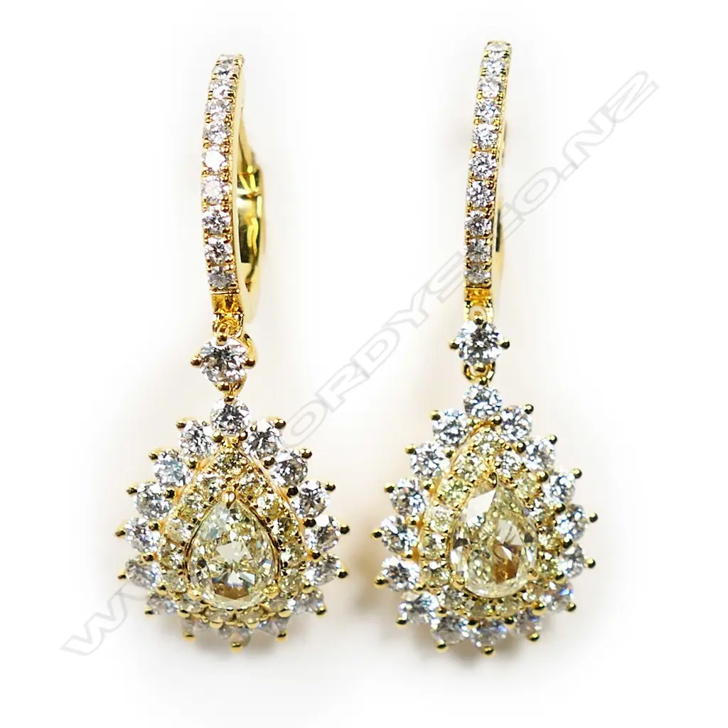 A pair of 18ct gold and diamond earrings, Image 1++