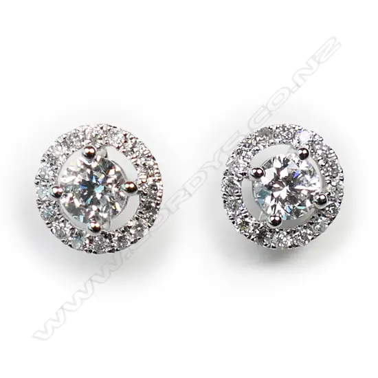 A pair of 18ct white gold and diamond stud earrings,