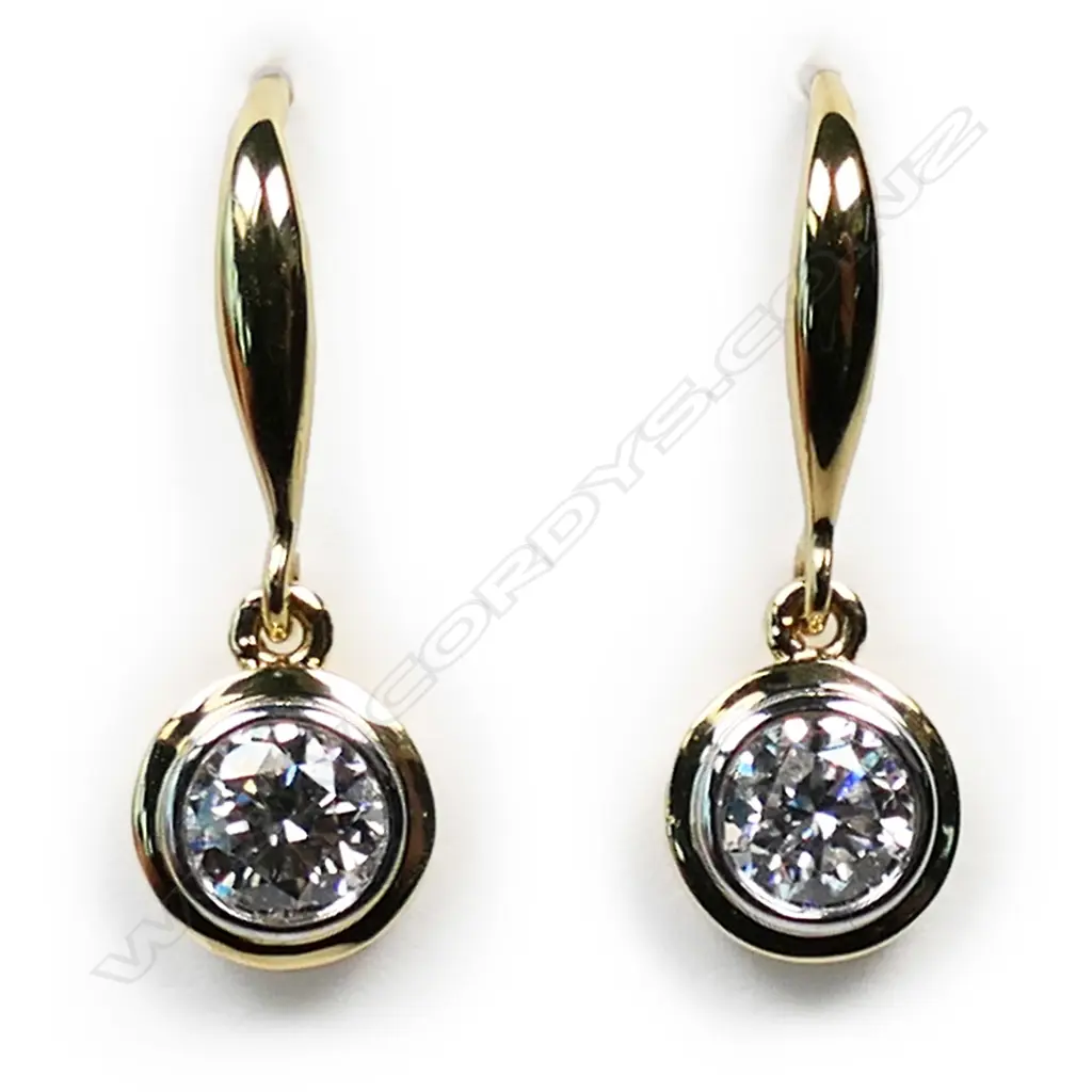 A pair of 18ct gold and diamond earrings, Image 1++