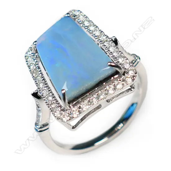 A 14ct white gold, opal and diamond halo ring,