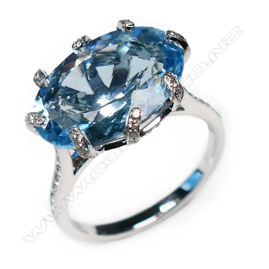 An 18ct white gold topaz and diamond dress ring, Image 1++