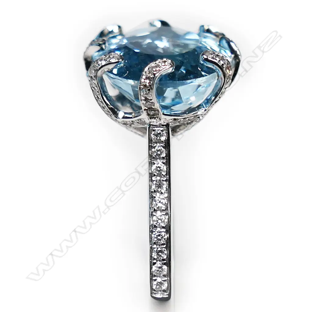 An 18ct white gold topaz and diamond dress ring, Image 1++