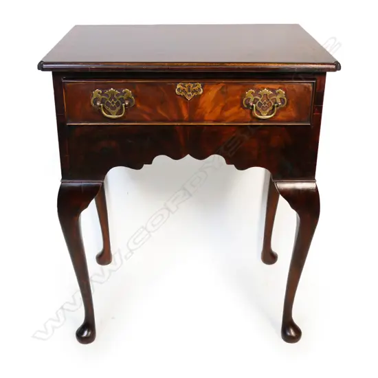 A quality Georgian style flame mahogany lowboy,