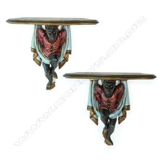 A pair of antique style figurative wall brackets,