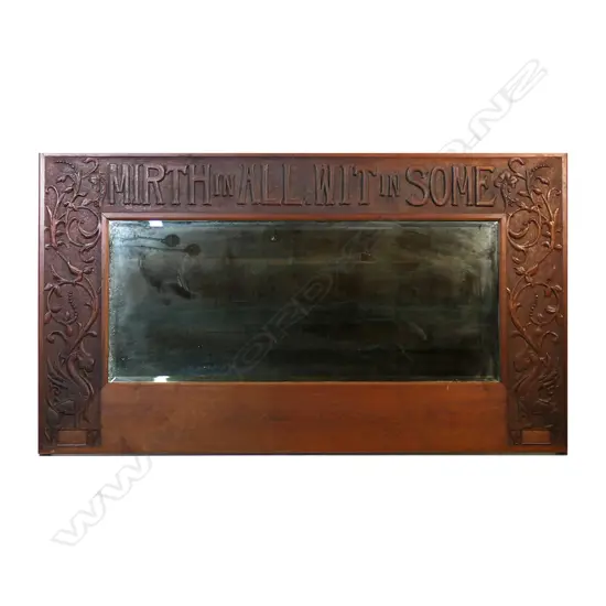 An early 1900s mahogany Arts and Crafts mirror,