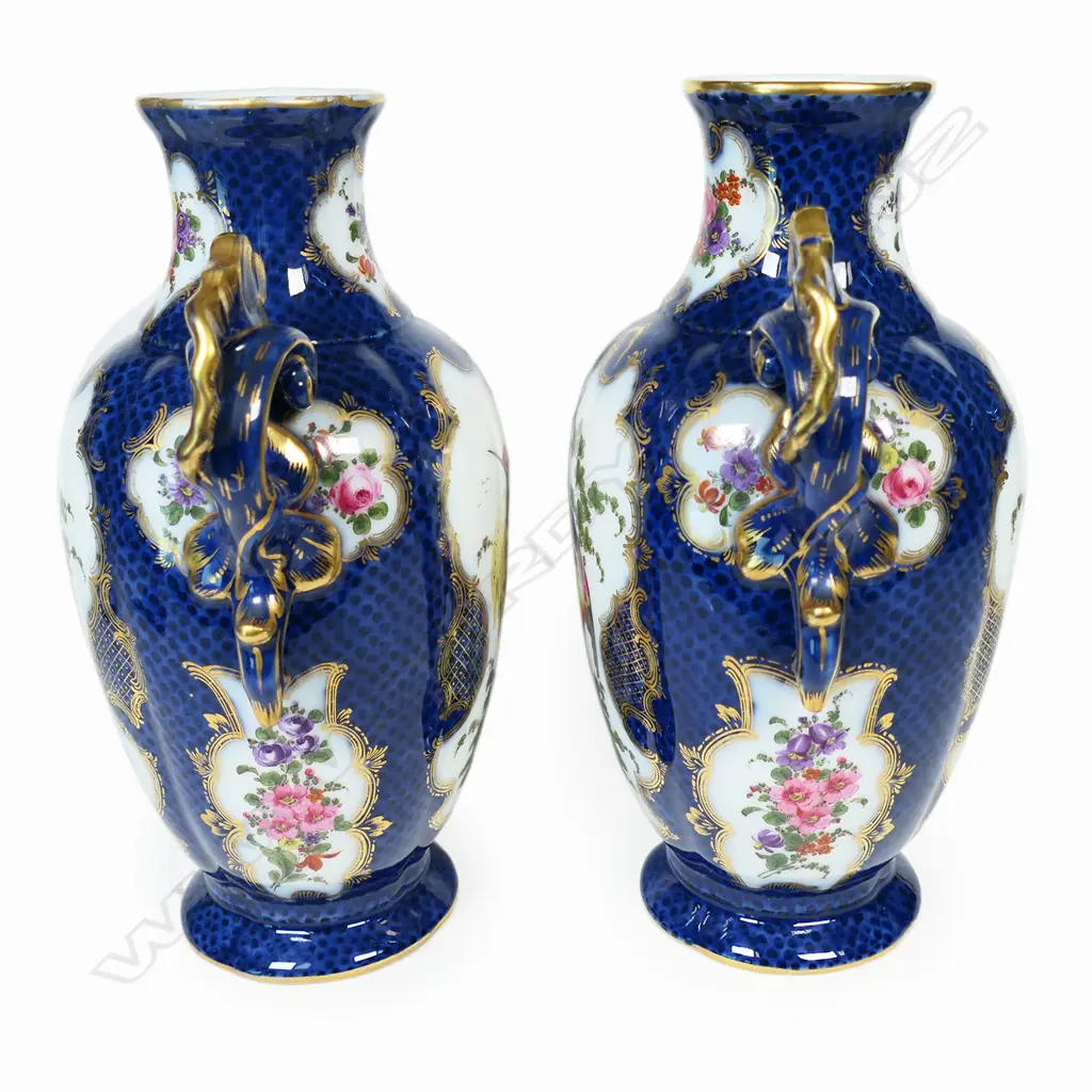 A pair of 18thC style mantel vases, painted in polychrome enamels with panels reserved on a scale blue ground and exotic birds and floral sprays, Image 1++