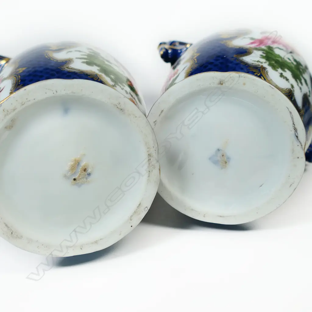 A pair of 18thC style mantel vases, painted in polychrome enamels with panels reserved on a scale blue ground and exotic birds and floral sprays, Image 1++