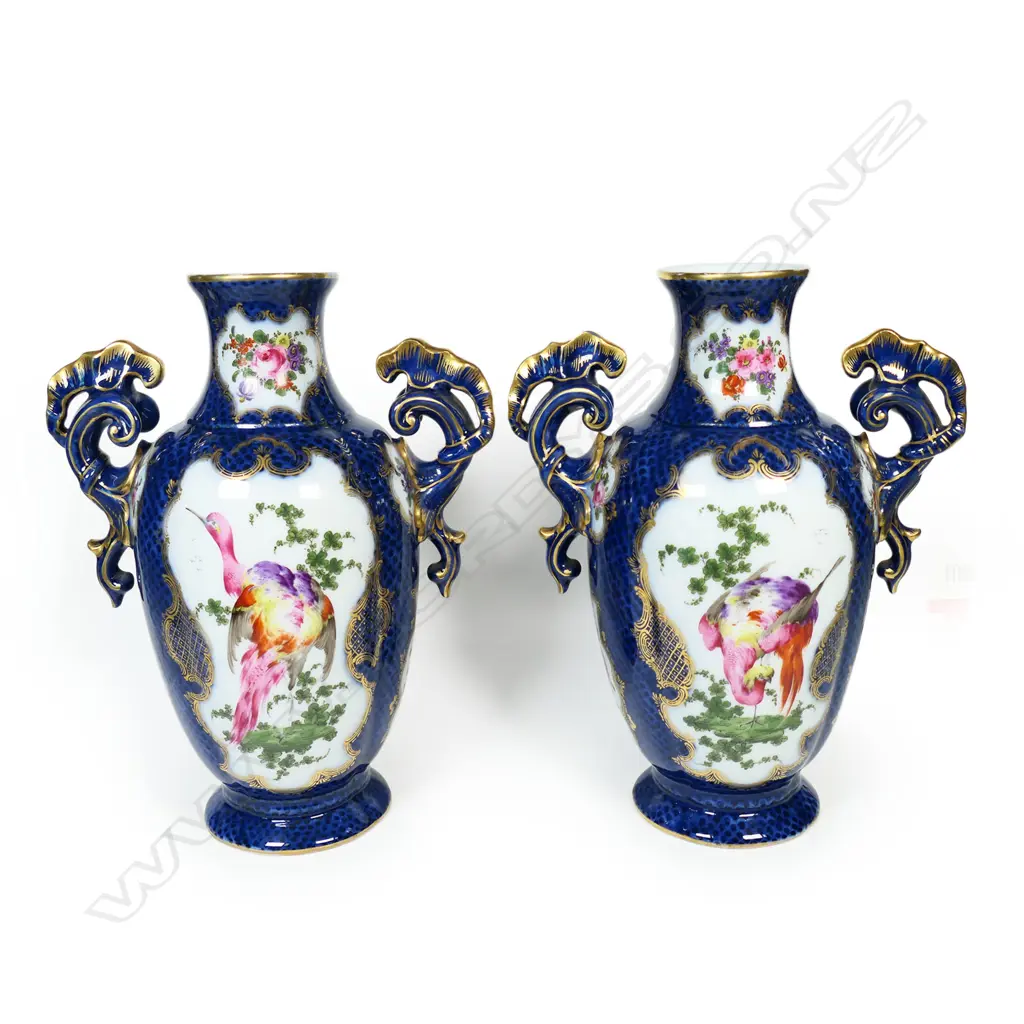 A pair of 18thC style mantel vases, painted in polychrome enamels with panels reserved on a scale blue ground and exotic birds and floral sprays, Image 1++