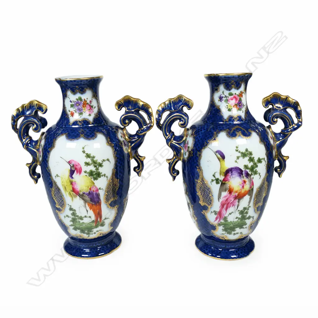 A pair of 18thC style mantel vases, painted in polychrome enamels with panels reserved on a scale blue ground and exotic birds and floral sprays, Image 1++