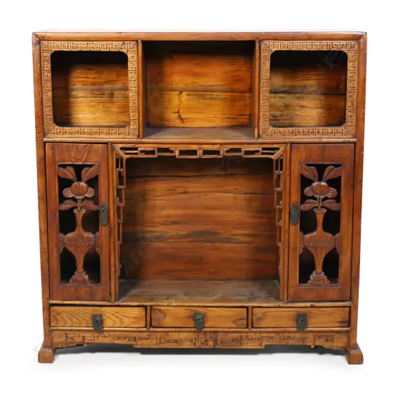 An old Chinese carved hardwood free-standing display cabinet,