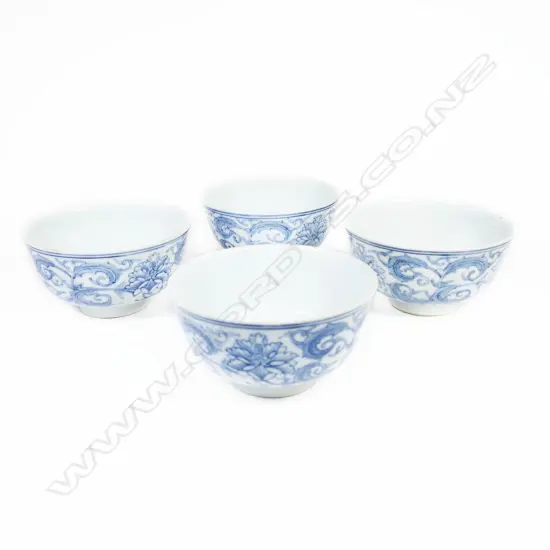 A set of four Chinese rise bowls in underglaze blue with plain interior. Six character mark to base. Dia.115mm. Possibly a shipwreck find.