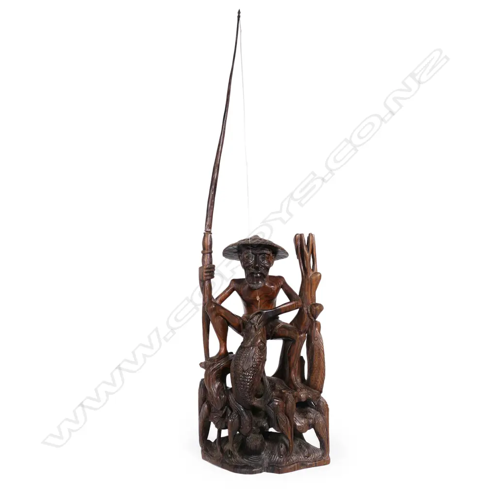 A Chinese carved hardwood sculpture of a fisherman, Image 1++