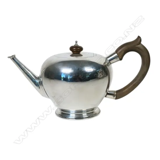 A 1953 Coronation year Georgian style silver bullet form tea pot,