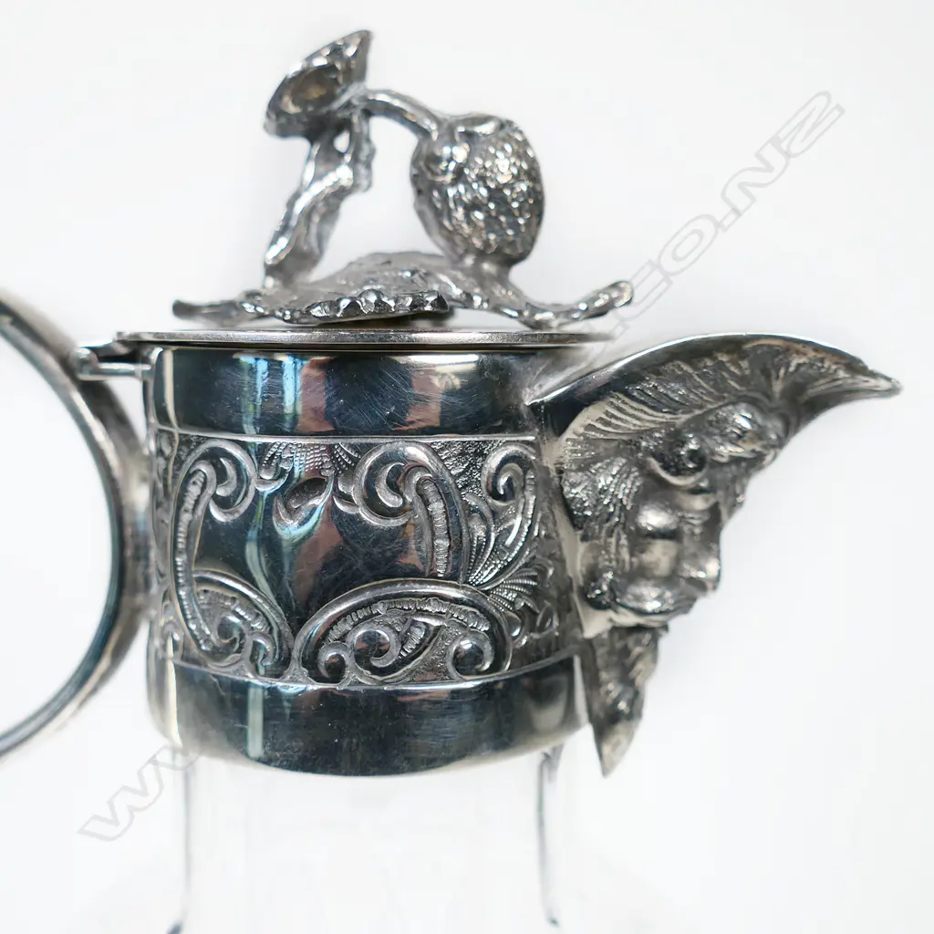 A Victorian silver plate and crystal claret jug elaborate cut decoration to the body, the spout in the form of the head of Bacchus with grape vine finial to lid, engraved collar and looping ear form handle. H.240mm. Image 1++