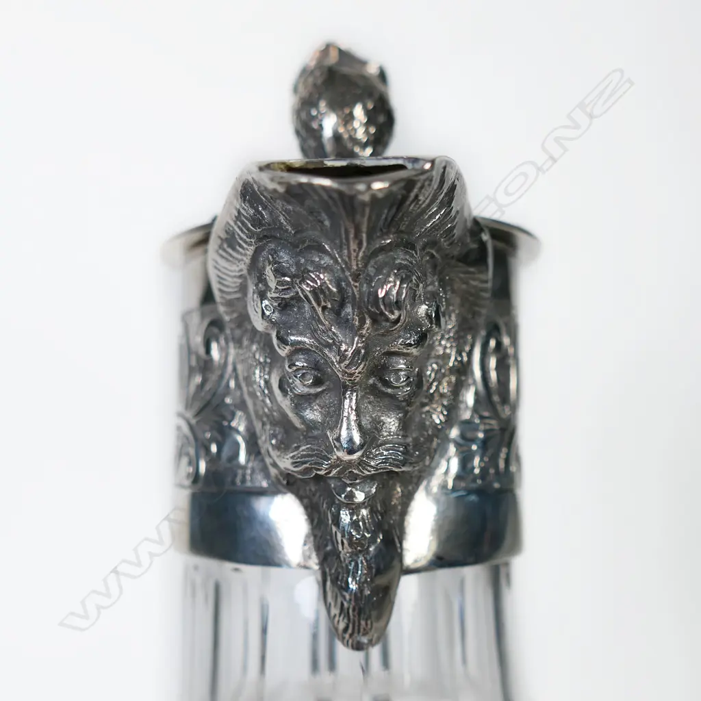 A Victorian silver plate and crystal claret jug elaborate cut decoration to the body, the spout in the form of the head of Bacchus with grape vine finial to lid, engraved collar and looping ear form handle. H.240mm. Image 1++