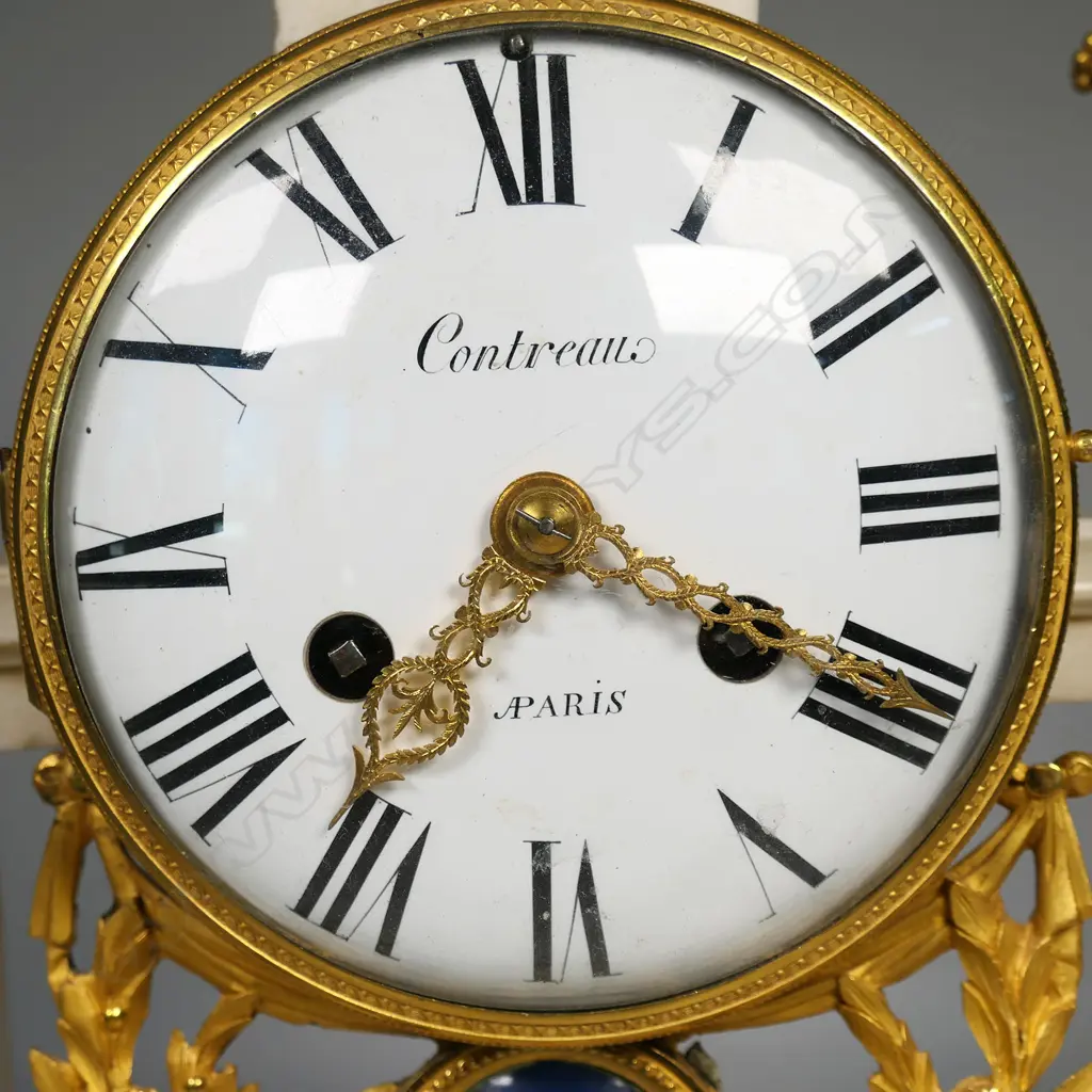 A Louis XVI white marble and ormolu mantel clock by Contreau of Paris, Image 1++