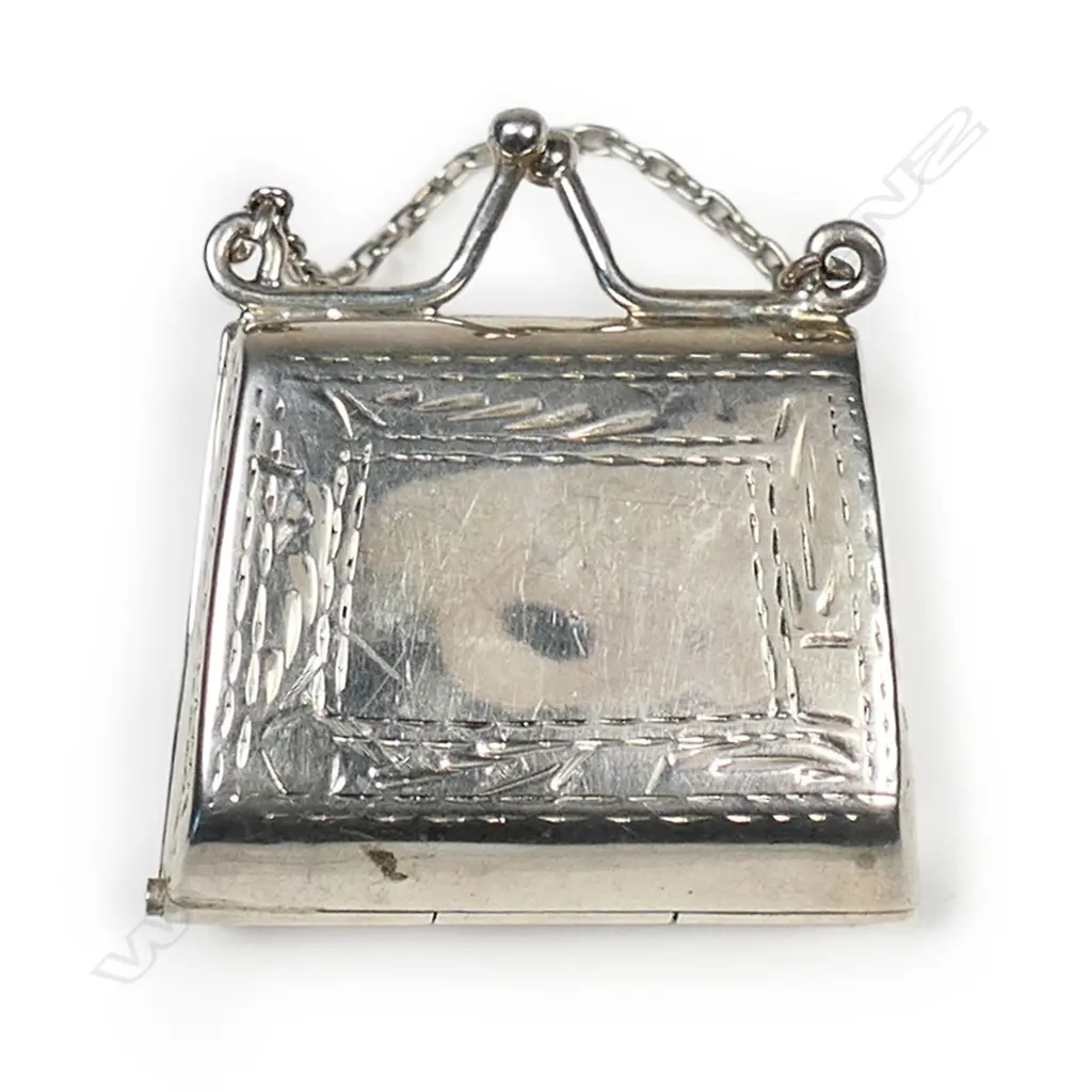 A silver stamp holder, Image 1++