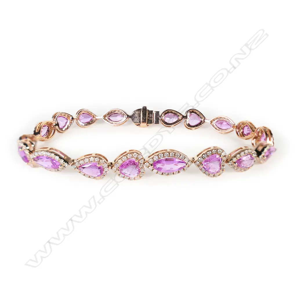 A 14ct rose gold pink sapphire and diamond halo bracelet, Image 1++