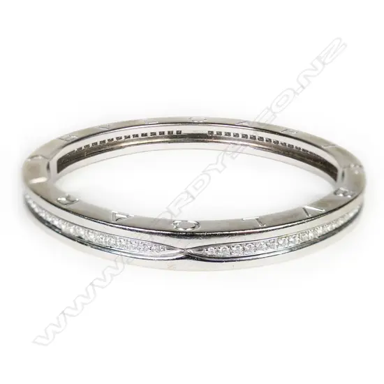 An 18ct white gold and diamond Bvlgari hinged bangle,