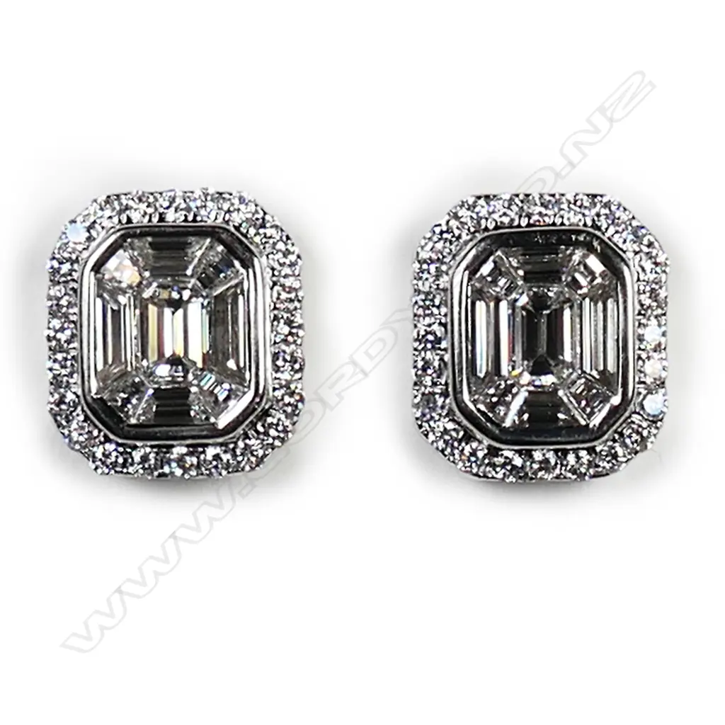 A pair of 18ct white gold and diamond stud earrings, Image 1++