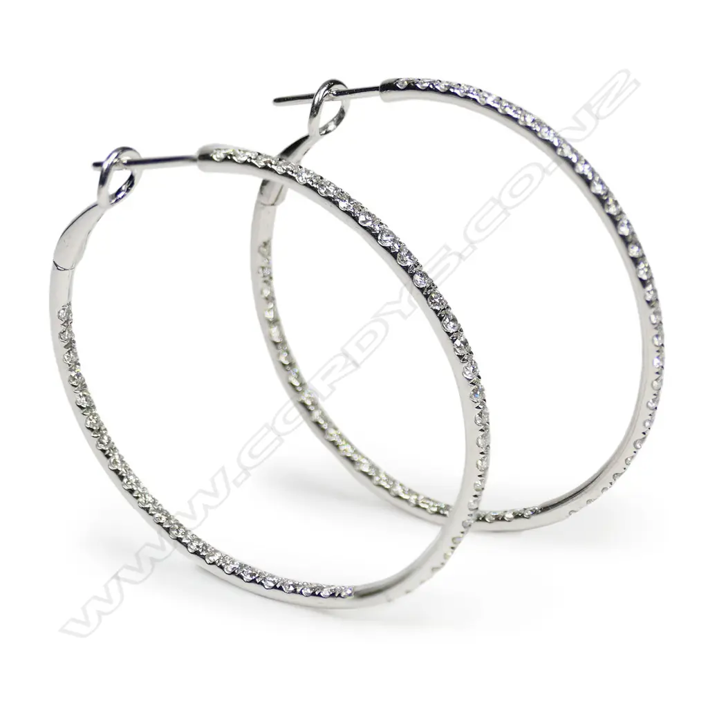 A pair of 18ct white gold and diamond hoop earrings, Image 1++
