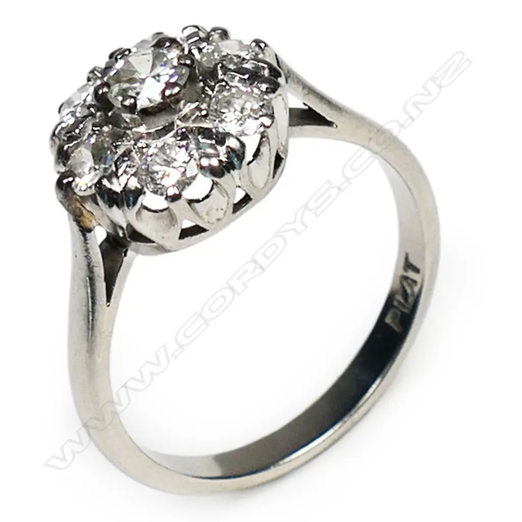 An estate platinum and diamond cluster ring, Image 1++