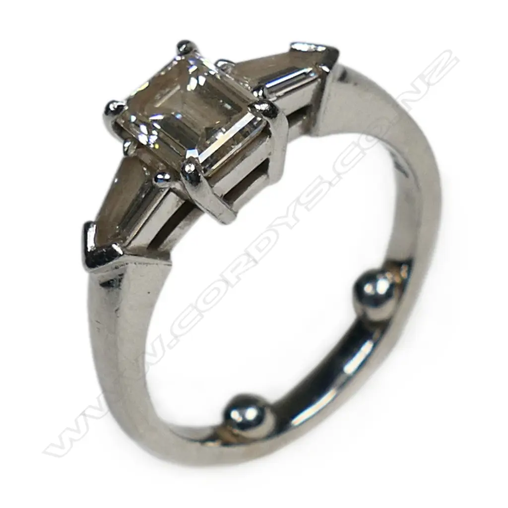 A bespoke platinum and diamond solitaire ring, Image 1++