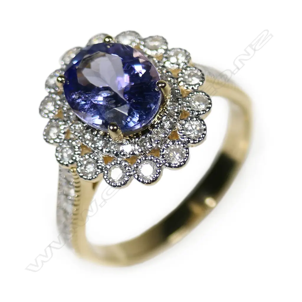 A 14ct gold tanzanite and diamond double halo ring, Image 1++