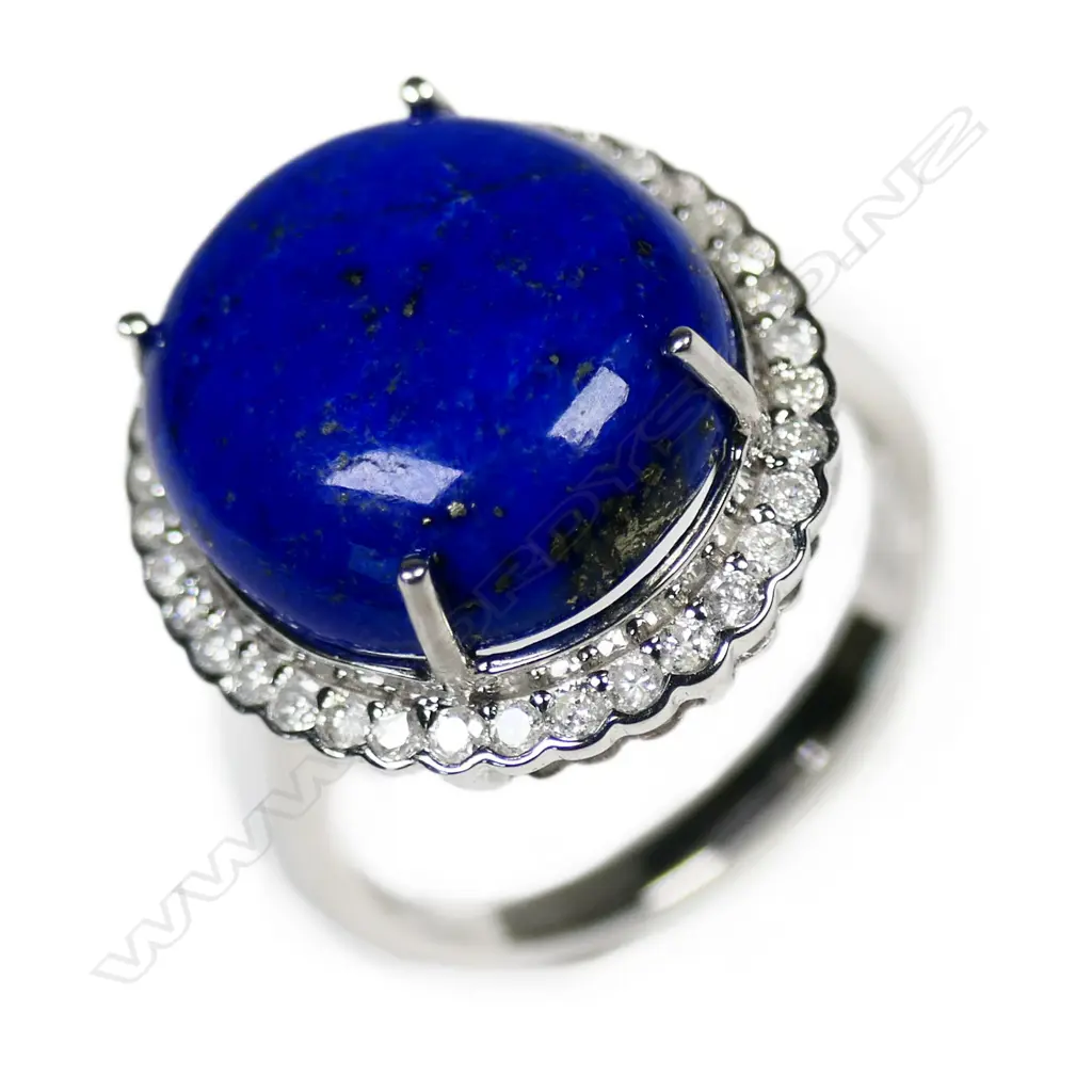 A 14ct white gold lapis lazuli and diamond halo ring, Image 1++