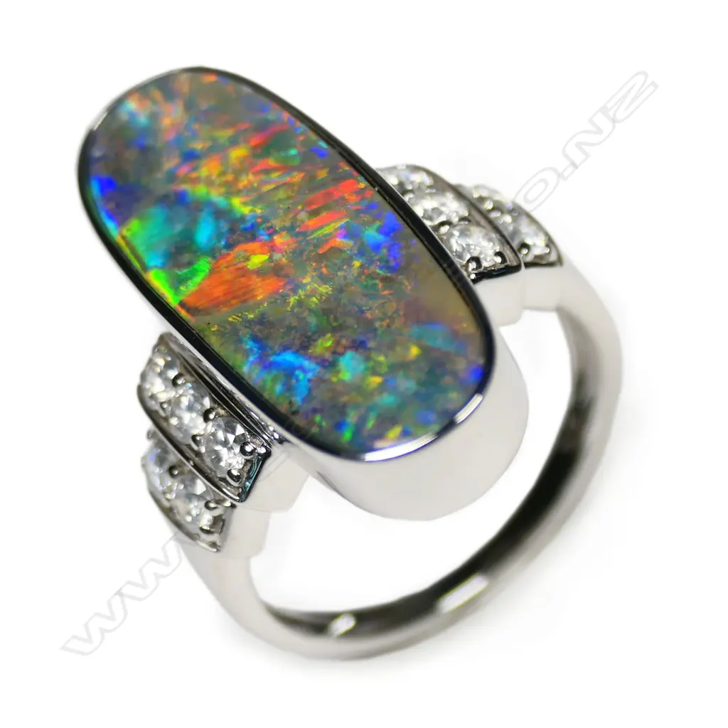 A 14ct white gold black opal and diamond ring, Image 1++