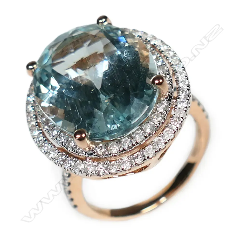 A 14ct rose gold aquamarine and diamond double halo ring, Image 1++