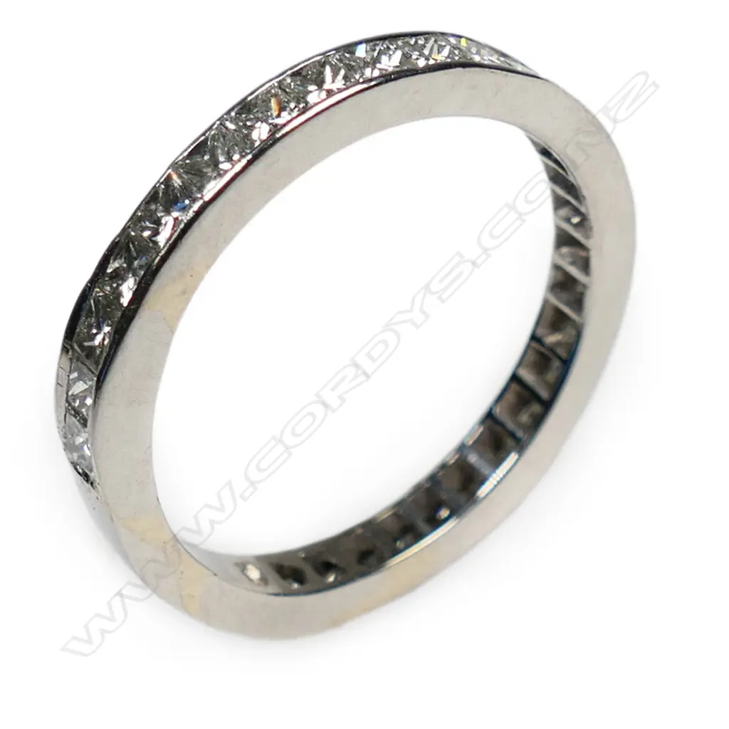 A platinum and diamond set band, Image 1++