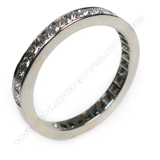 A platinum and diamond set band,
