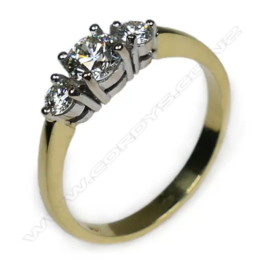 An 18ct gold and three stone diamond ring,