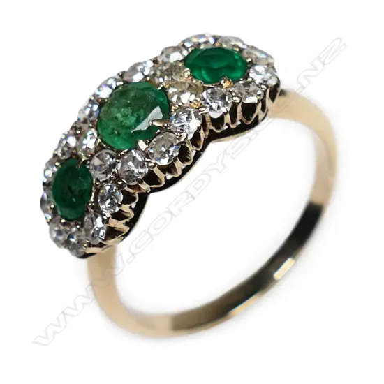 An antique 12ct rose gold emerald and diamond ring,
