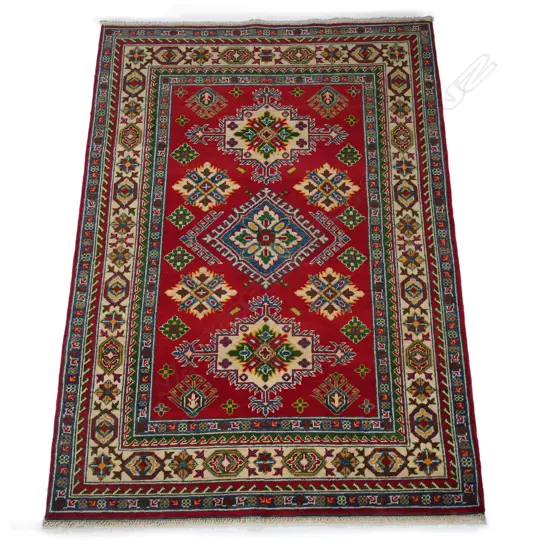 A fine hand-knotted Persian Kazak rug,