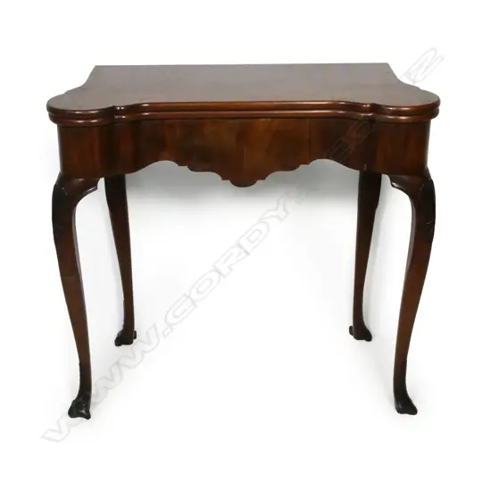 A George III Chippendale style fold-over top games table,