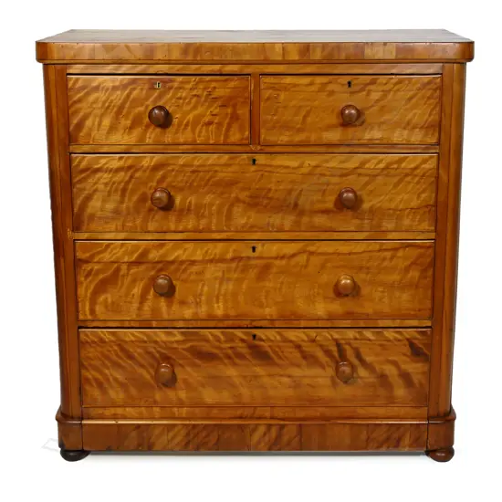 A Victorian figured golden mahogany five drawer chest,